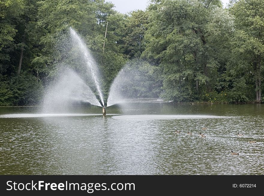 Fountain in summer day in park. Fountain in summer day in park