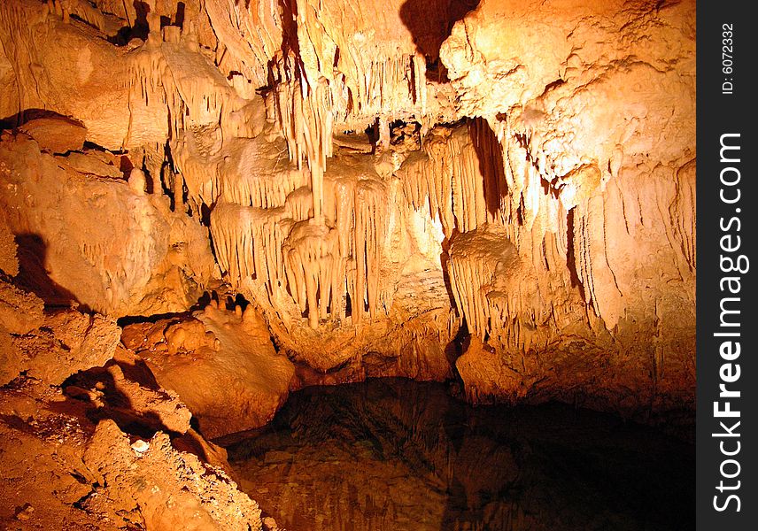 The underground water with stalactites inside Crystal & Fantasy caves in Bermuda. The underground water with stalactites inside Crystal & Fantasy caves in Bermuda.