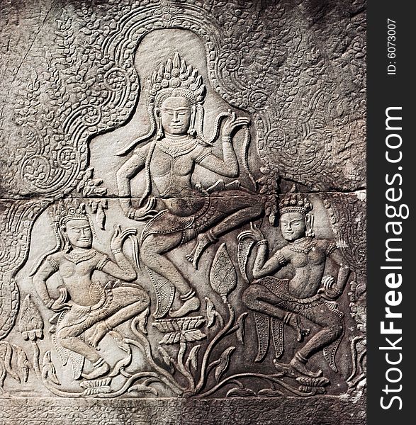 Dancing devatas - stone engraving on the wall of the Bayon Temple in Siem Reap, Cambodia