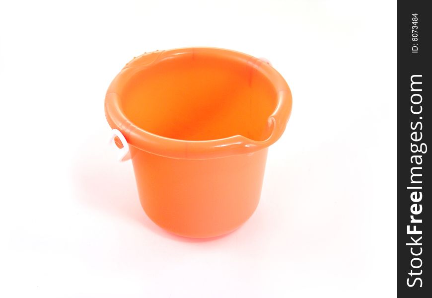 Small orange sand pail isolated on white background. Small orange sand pail isolated on white background