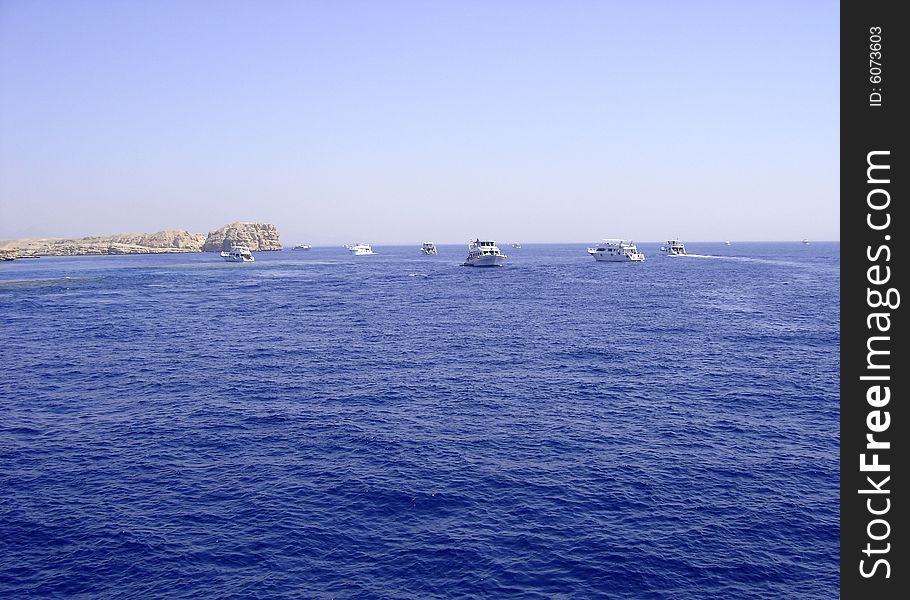 Scuba diving boats sailing in the Red Sea off Sharm el Sheikh, Egypt.