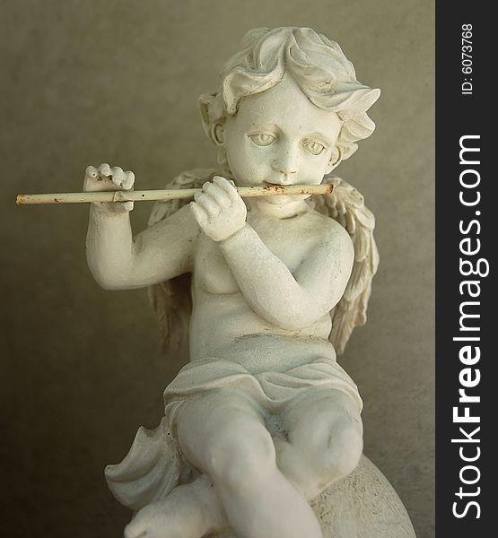 Old figurine - Flute playing angel