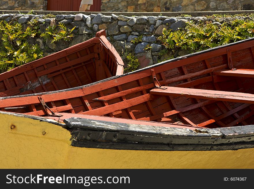 Two old abandoned fishing boat, lying on dry dock in Hermanus harbor. Two old abandoned fishing boat, lying on dry dock in Hermanus harbor