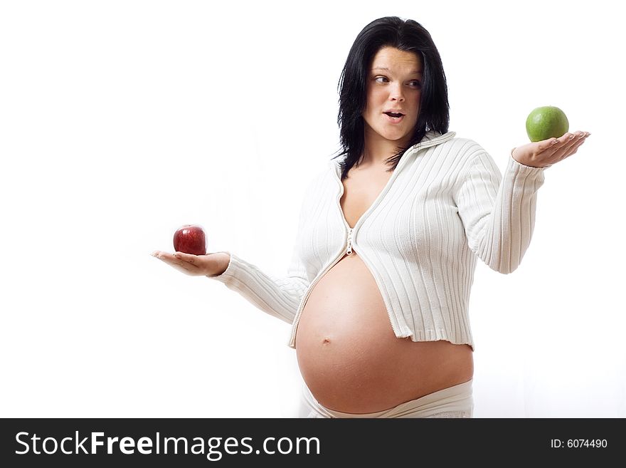 Beautiful pregnant woman choosing apples. Beautiful pregnant woman choosing apples.
