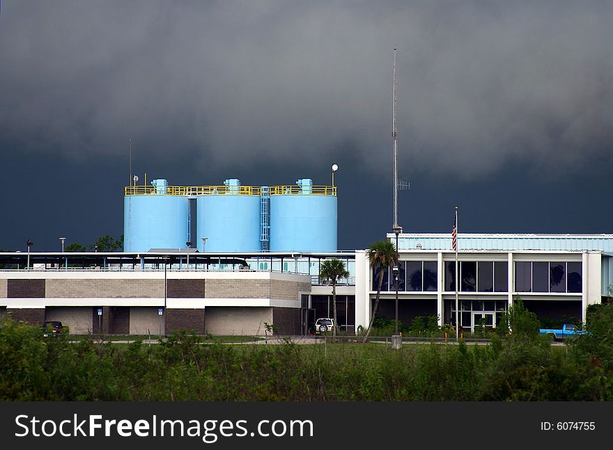 Pale blue holding tanks at a Florida water treatment plant, set against an ominously dark sky.

PHOTO ID: H2OTreatment00005. Pale blue holding tanks at a Florida water treatment plant, set against an ominously dark sky.

PHOTO ID: H2OTreatment00005