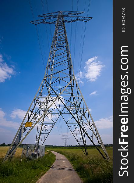 High voltage power tower in a rural farmlandscape