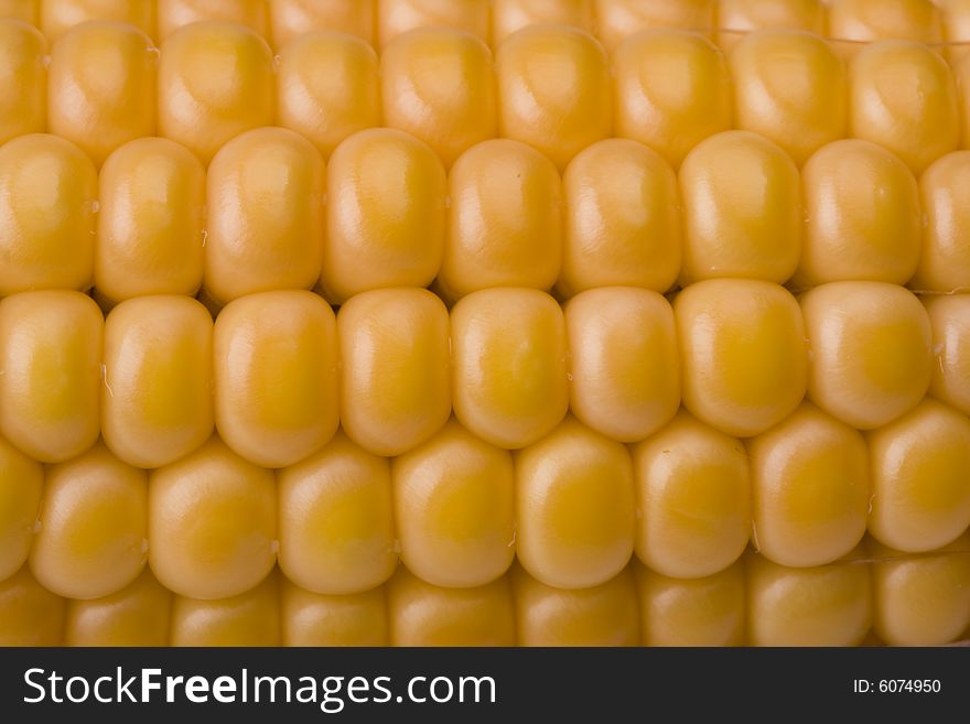 Detail of a fresh corn cob on white background