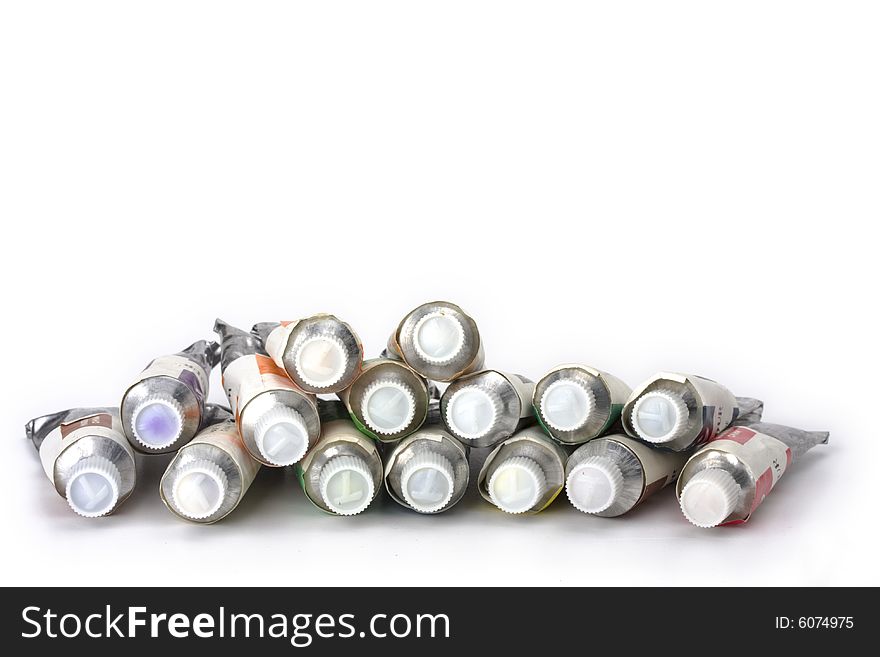 A lot of paint tubes on white background