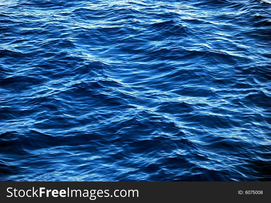 Ripples on blue sea water