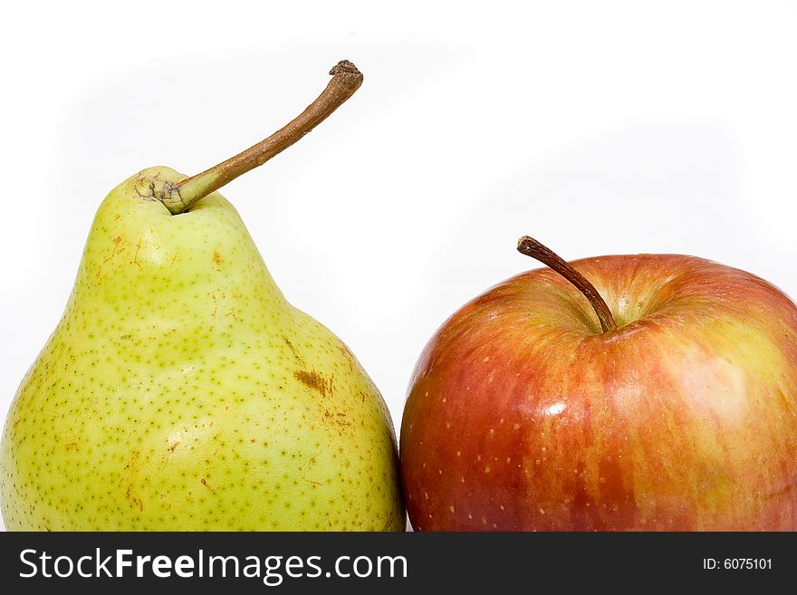 An apple with a pear on a white background. An apple with a pear on a white background