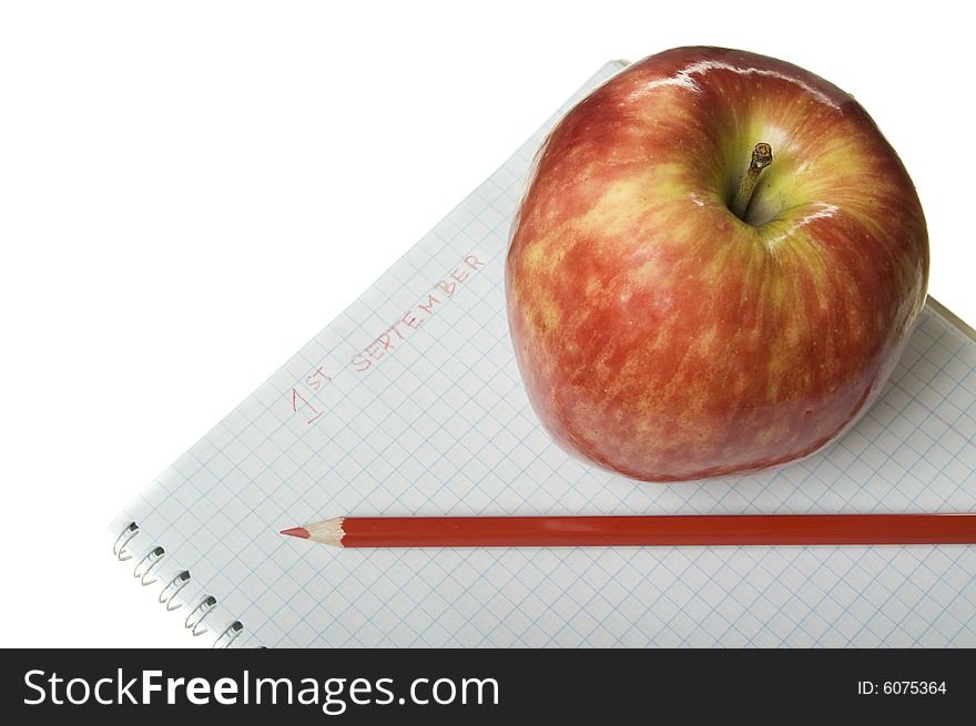 Red apple with notebook and red pencil. Red apple with notebook and red pencil