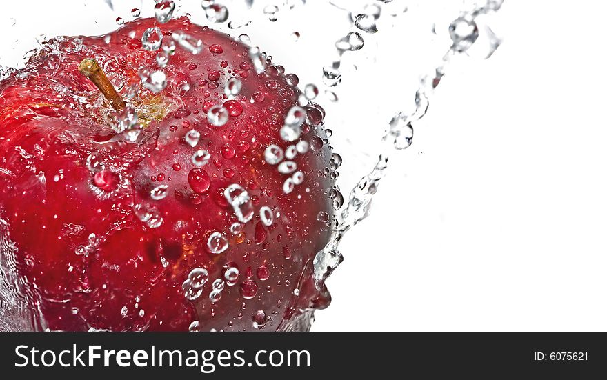 Red apple with drop of water isolated on white background