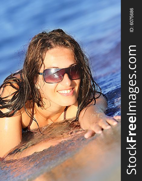 Young woman at beach in the sea