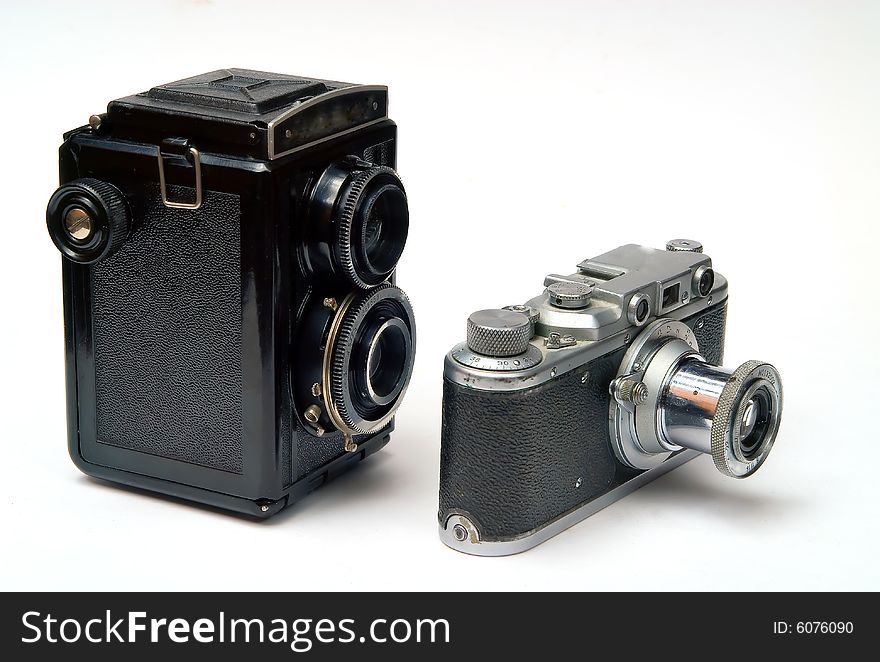 Two old photo cameras on white background. Two old photo cameras on white background