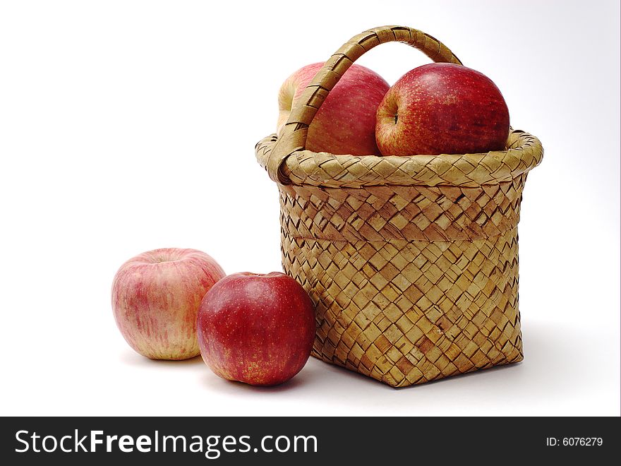 Apples and wooden handmade basket. Apples and wooden handmade basket