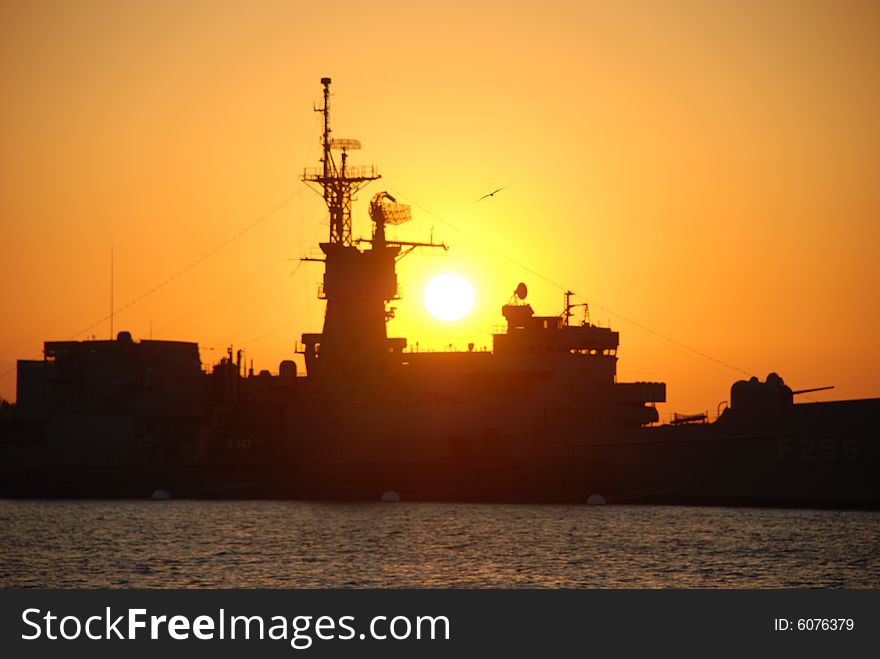 Seeming a battle ship at sunset