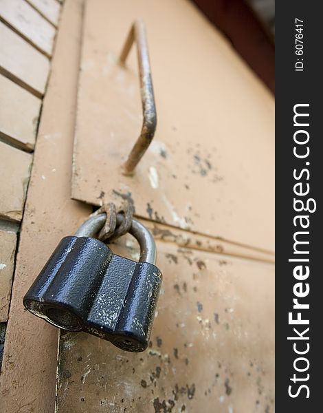 Old door and old lock that lock up it