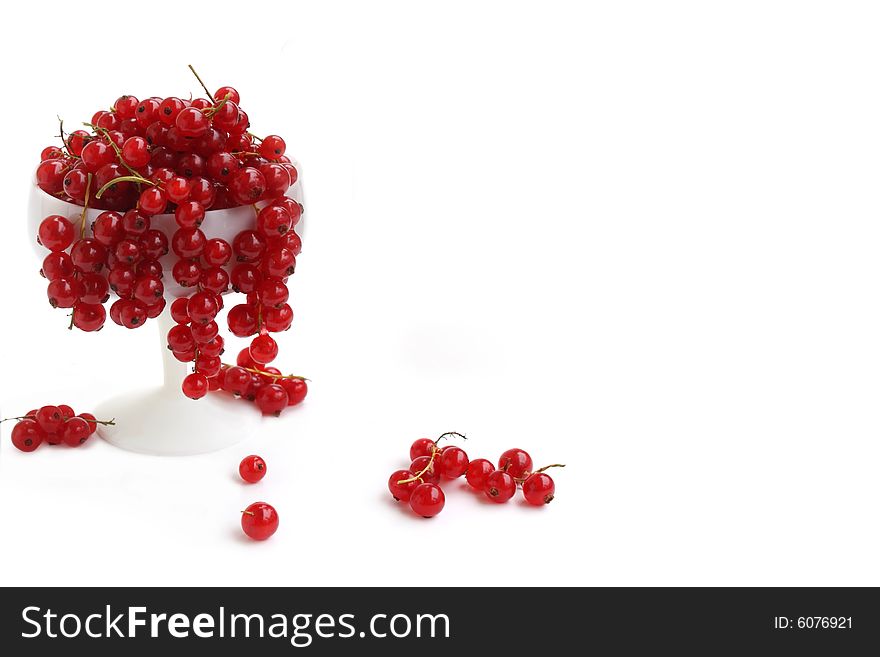 Bowl of red currants on white background