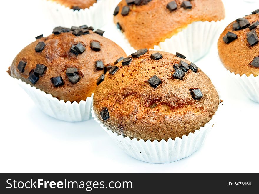 Chocolate muffins with decoration - isolated on white background.