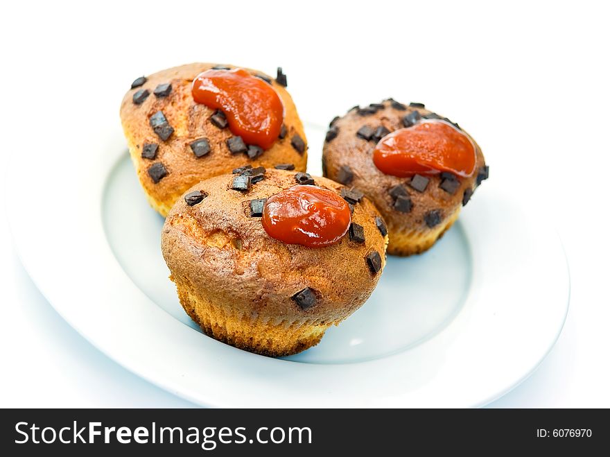 Chocolate muffins with decoration - isolated on white background.