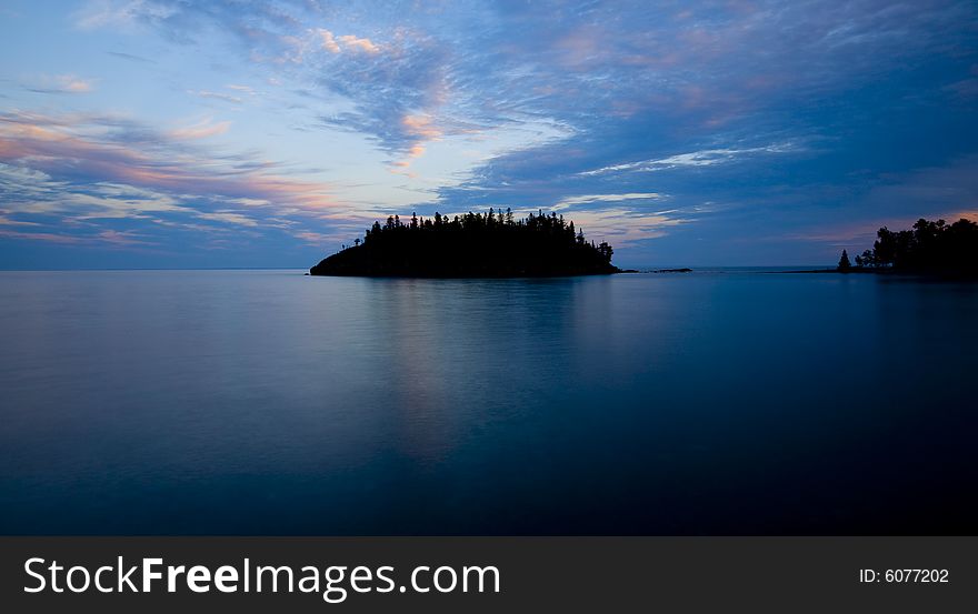 An island of the shore of Lake Superior in blue. An island of the shore of Lake Superior in blue