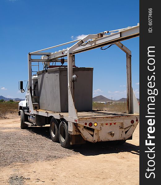 Large semi truck on a construction site. Vertically framed photo. Large semi truck on a construction site. Vertically framed photo.