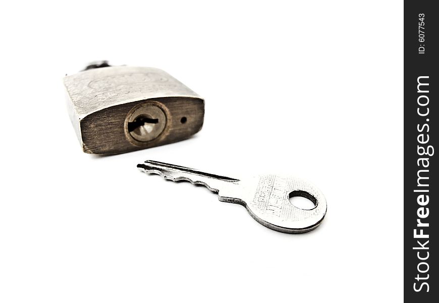 Macro shot of key with padlock. Macro shot of key with padlock