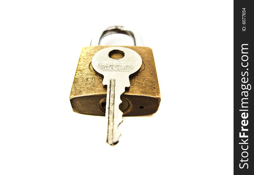 Macro shot of key with padlock. Macro shot of key with padlock