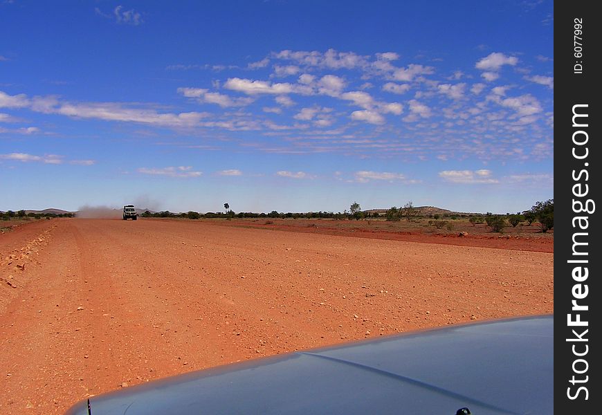 Driving along the Ernest Giles Road from Alice Springs to Kings Canyon