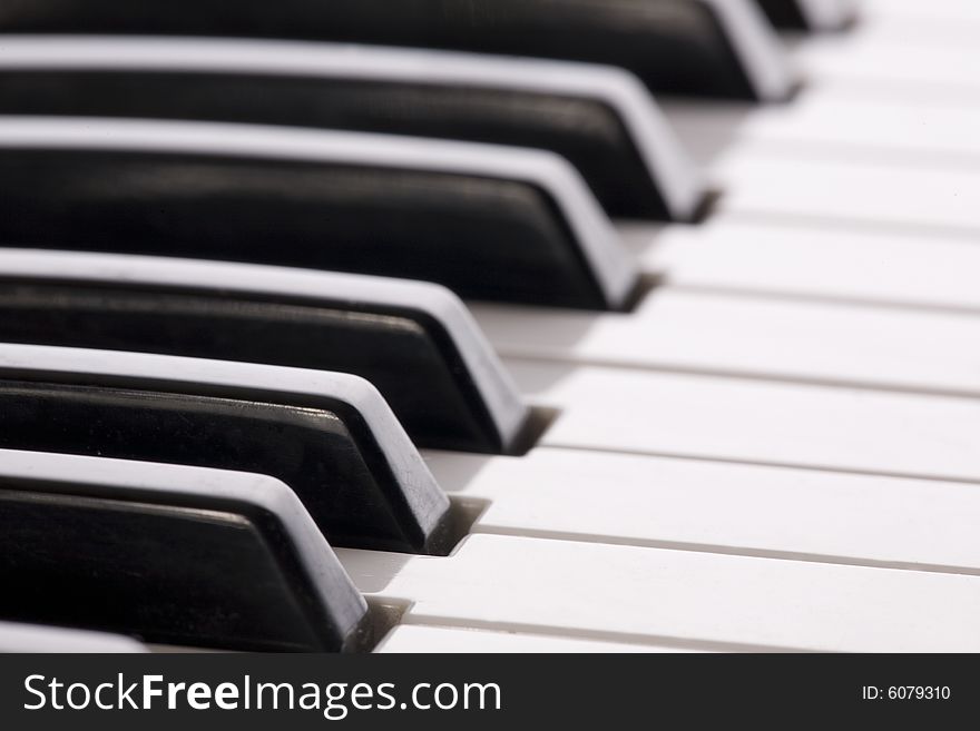 Keyboard extending to the horizon on a close up image of a synthesizer. Keyboard extending to the horizon on a close up image of a synthesizer.