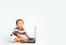 Happy Toddler Using A Laptop Royalty Free Stock Images