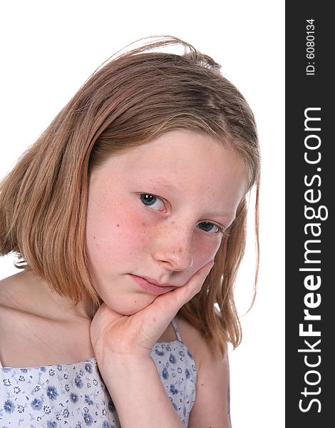 Frecked girl with chin on hand and looking sad. Frecked girl with chin on hand and looking sad