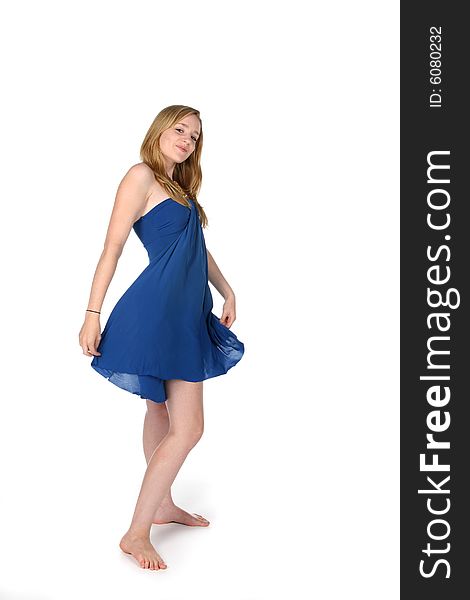 Woman twirling in a blue dress. Woman twirling in a blue dress