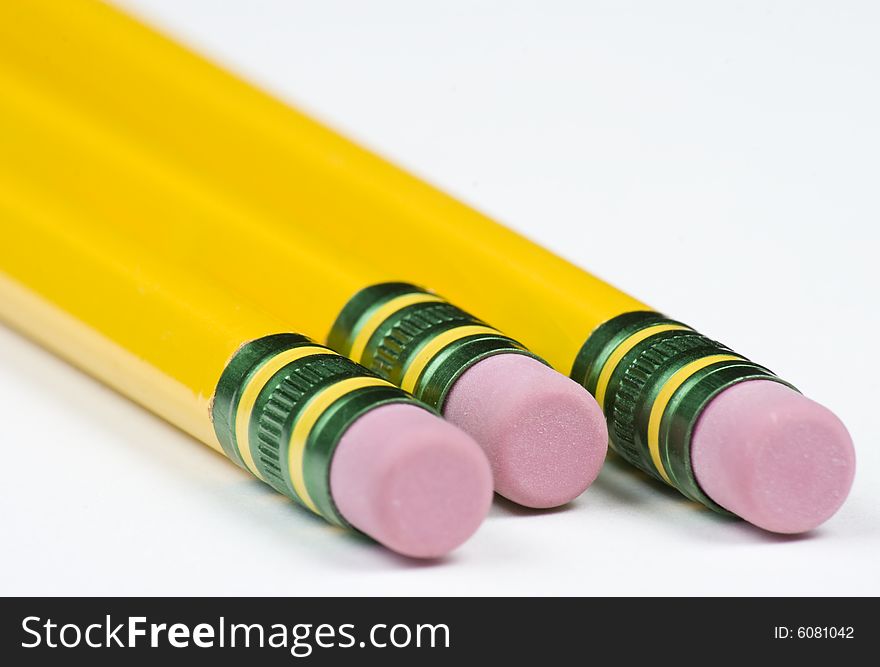 Three Pencils Eraser End Close Up on White. Three Pencils Eraser End Close Up on White