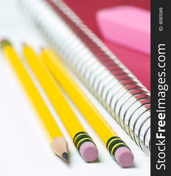 Three Pencils With Notebook