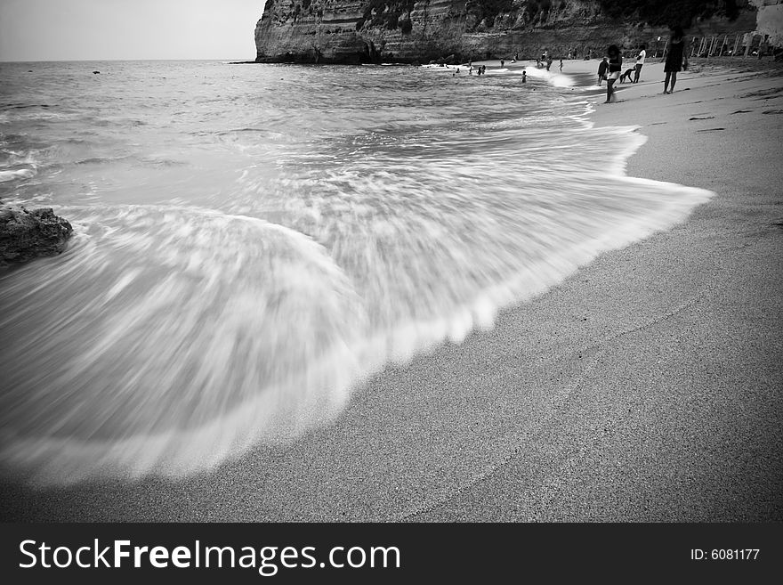 Long exposed wave in beautiful beach, monochrome toned.