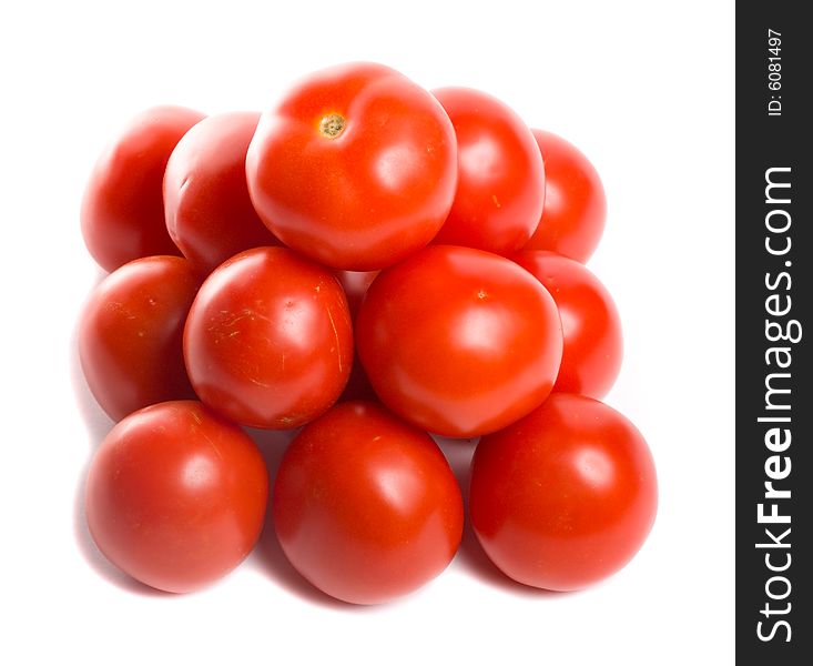 Close-up tomatoes in pyramid, isolated on white