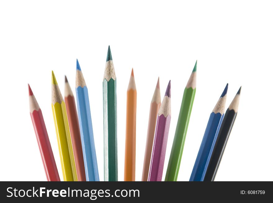 Eleven color pencils upright on a white background