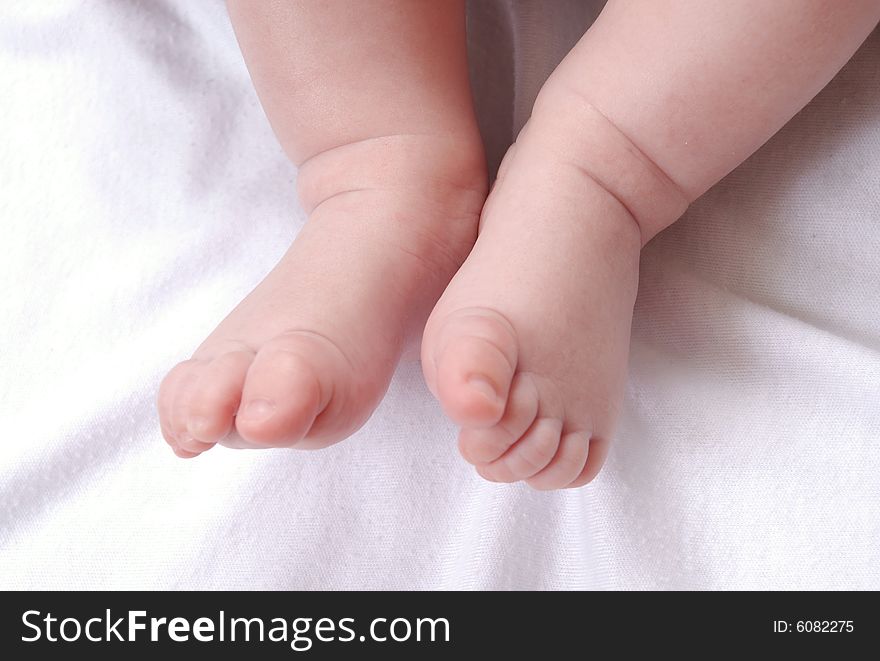 Father's and baby's hands isolated on white