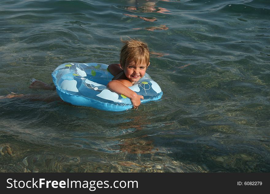 Girl Floats On A Lifebuoy Ring