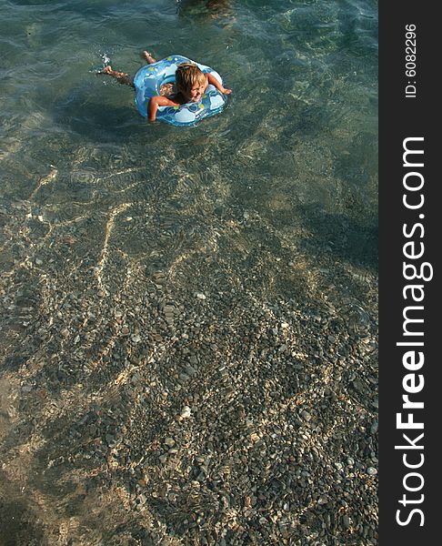 Girl Floats On A Lifebuoy Ring