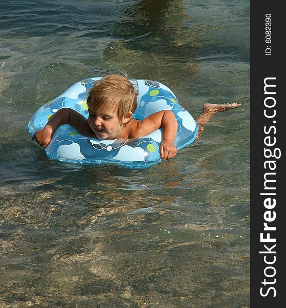 Girl Floats On A Lifebuoy Ring