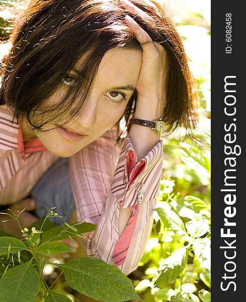 Closeup portrait of brunet woman in the forest