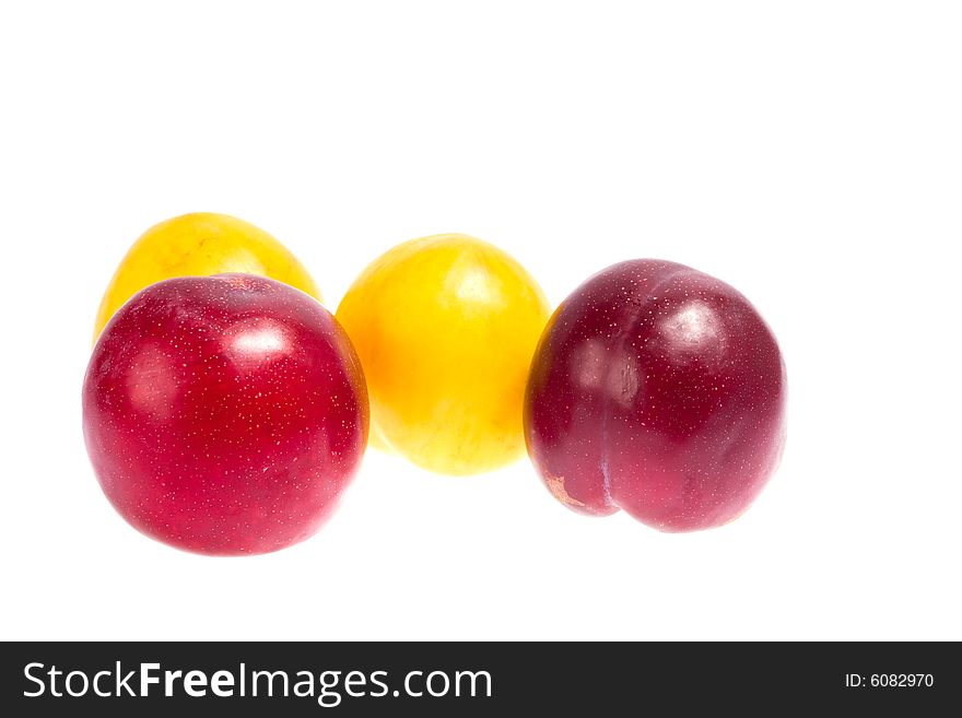 Large plums isolated on the white background. Large plums isolated on the white background