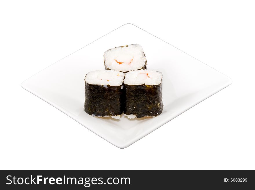A square white plate with three pieces of sushi