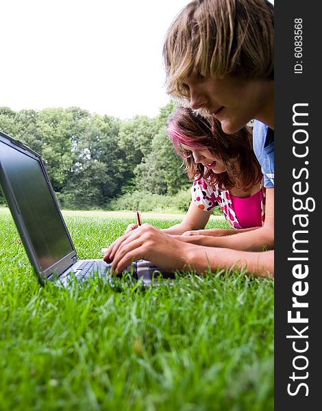 Students studying in a park in the summertime. Students studying in a park in the summertime