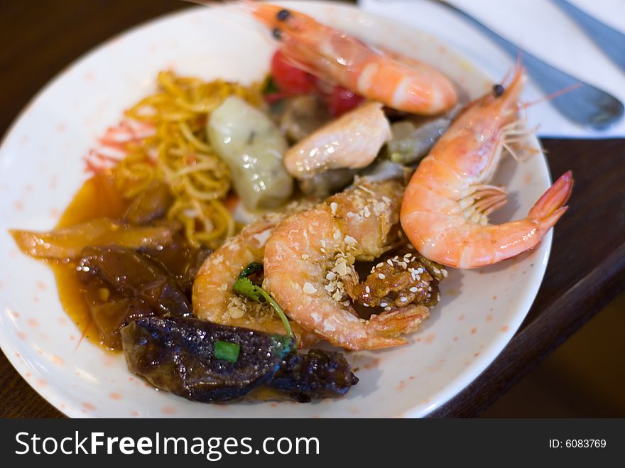 Shimp with noodle in white plate on dining table. Shimp with noodle in white plate on dining table