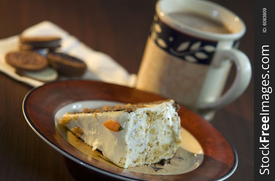 A carrot cake paired with cookies and choco milk. A carrot cake paired with cookies and choco milk.