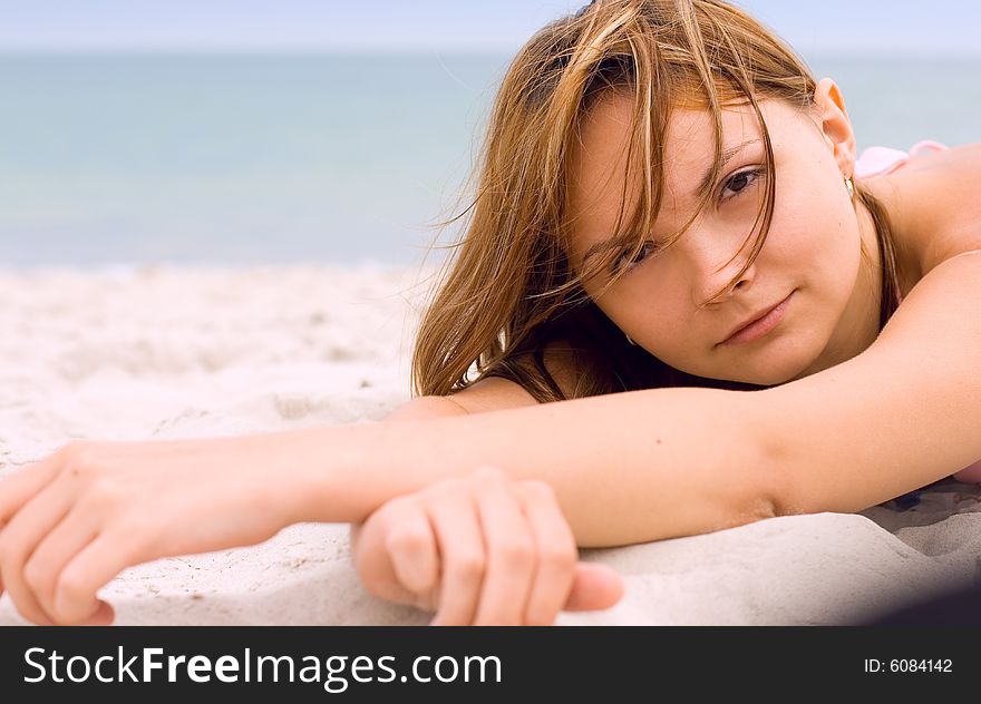 Attractive woman lying on the beach