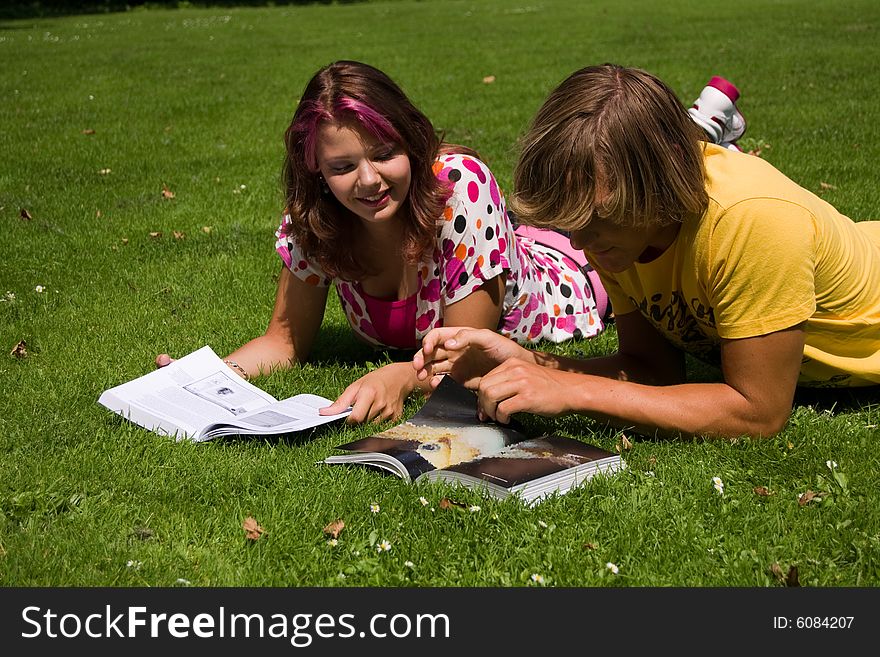 Students studying in a park in the summertime. Students studying in a park in the summertime